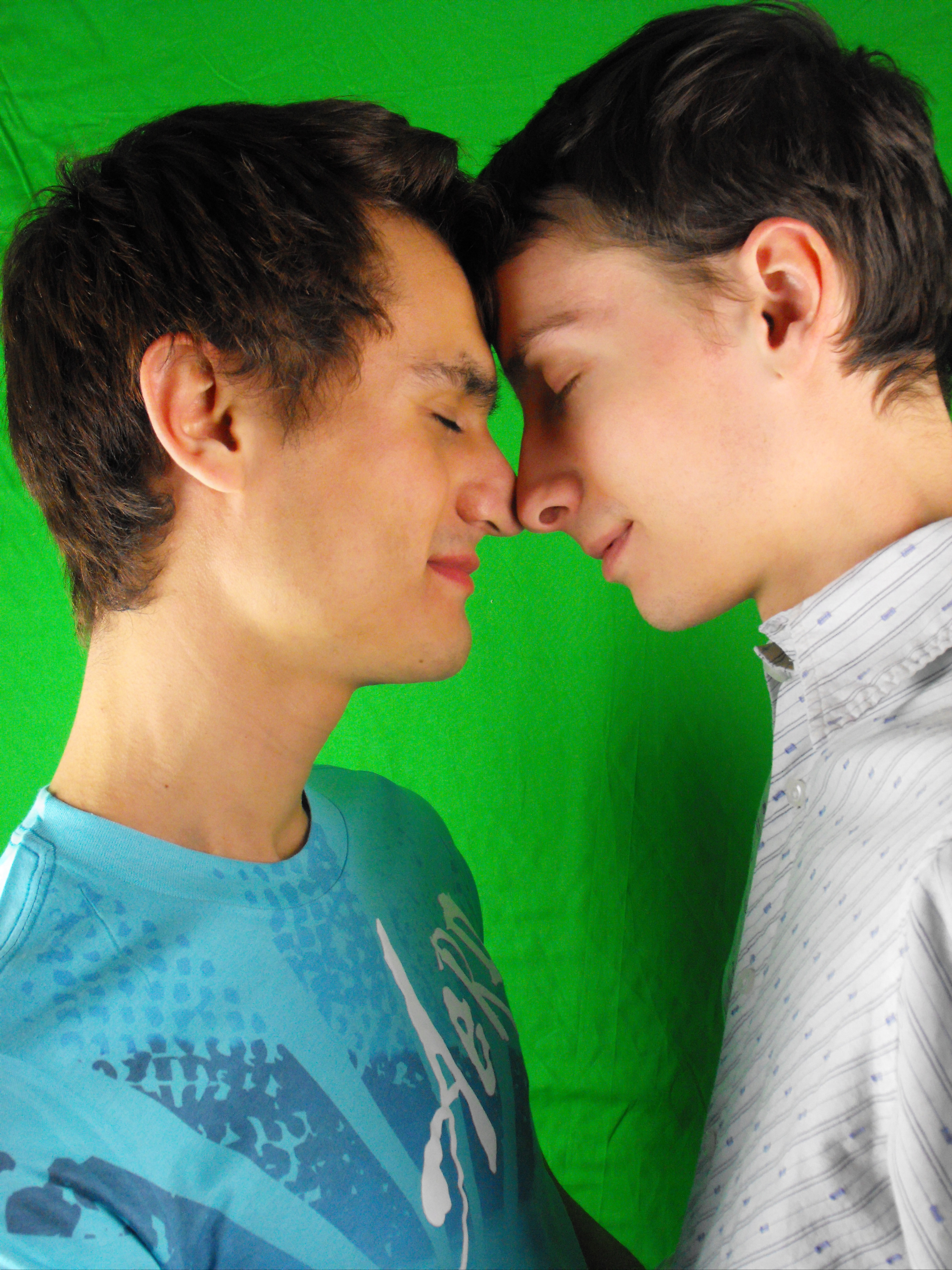 Kiss between a gay couple in love by Michela Ravasio 